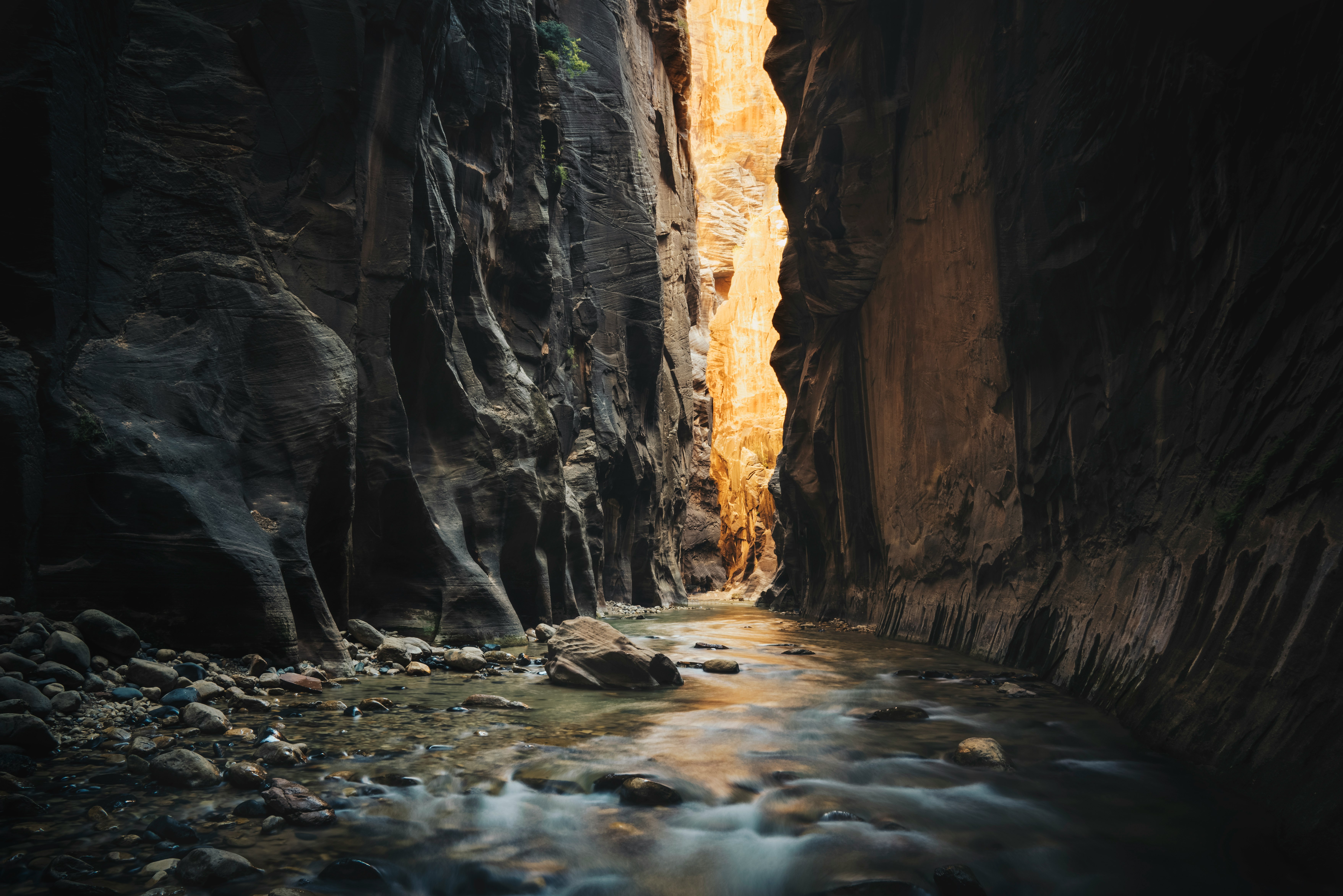 body of water on ridge between two rock formations